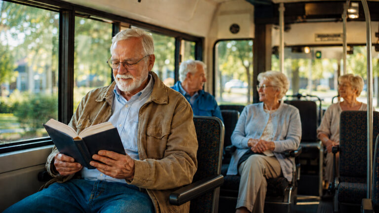 Senior riding in the passenger seat of a car